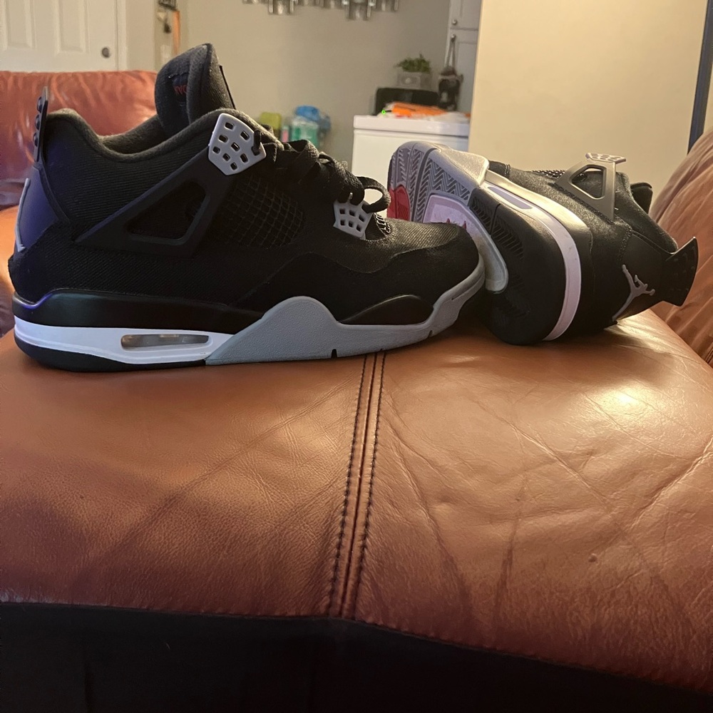 Black and Gray Jordan 4 Sneakers with Mesh Panels